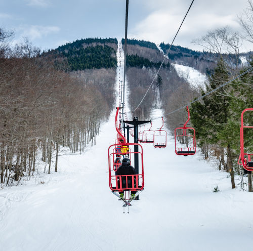 chairlift photo looking up chairlift at magic mountain ski area in vermont